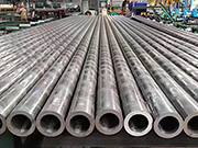 What are the methods for calibrating the precision of machine tools used in precision steel pipe processing